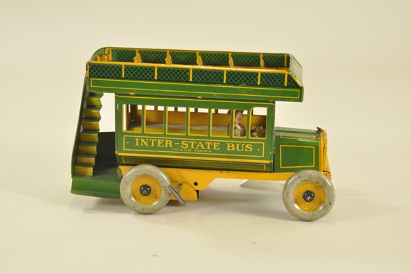 INTERSTATE BUS: Ferdinand Strauss, lithographed tin, done in green & yellow, double decker styling w/roof mounted bench seats, clockwork driven. 10 1/2" l.