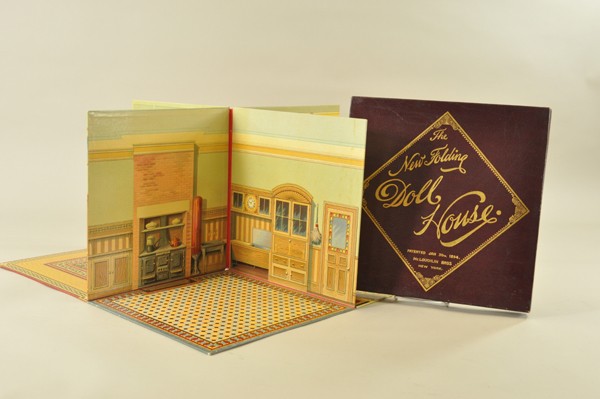 MCLOUGHLIN'S NEW FOLDING DOLL HOUSE: circa. 1894, beautiful boxed example, fold-out doll house opens to reveal extremely colorful interiors of parlor, kitchen, dining room and bedroom; a very elaborate backdrop. Fabulous label on inside 