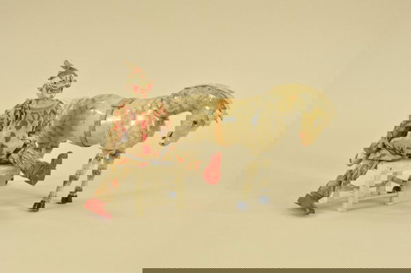 SCHOENHUT CLOWN & HORSE: Lot includes two part compo head clown in original outfit, white glass eyed Schoenhut horse with black highlights and white chair accessory. Clown 8" h., horse 10 1/4" h.