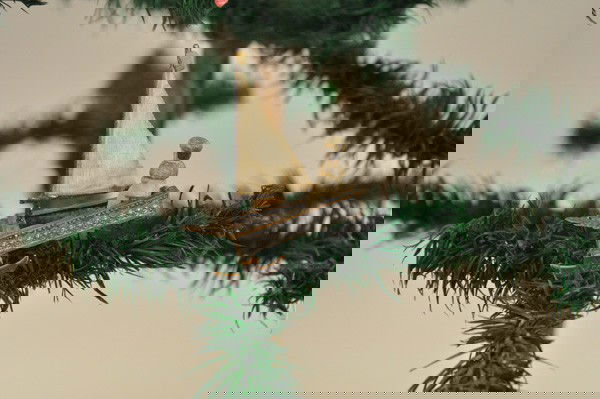 DRESDEN ICE BOAT WITH RIDER: Nice example of tri-blade sailing vessel, dresden figure posed at tiller, cloth sail with flag at top. 3" t.