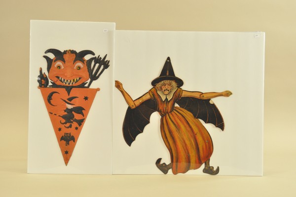 TWO EARLY HALLOWEEN ITEMS: Both done with great detail, articulated witch by Beistle is jointed at arms, hips and legs; embossed devil head pennant is of German origin. 15" - 17" t.