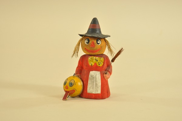 LOT OF TWO HALLOWEEN ITEMS: Composition, hand painted witch holds wire whisk broom in hand, head removes for candy storage; jack-o-lantern has movable tongue operated by pulling string inserted through head. 1-1/2" - 6-1/4" t.
