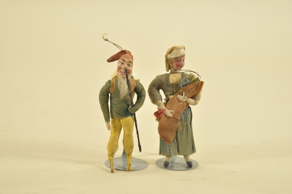 LOT OF TWO SPUN COTTON & CREPE PAPER FIGURES: Germany, elf-like man carries a walking stick and back pack, lady is holding a bundle of straw flowers, both interesting and colorful figures.