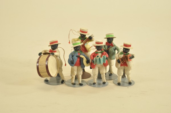 GROUPING OF SIX BLACK FACE VAUDEVILLE BAND FIGURE: Extremely rare set with spun cotton bodies with bisque faces, this group of child-like minstrels are all playing instruments and dressed in bright clothing with straw hats. 3 1/2" t.