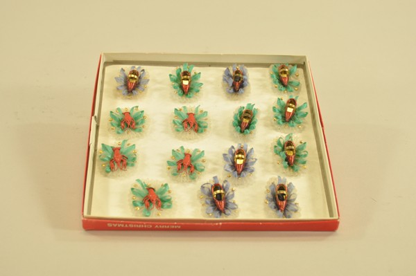 GROUPING OF METAL WEDDING SLIPPERS: Wonderful metal wedding slippers and red lobsters on layered green and blue netting, these items were part of a sample group from Germany sent to a toy store that was closed long ago. 1-3/4" ea.
