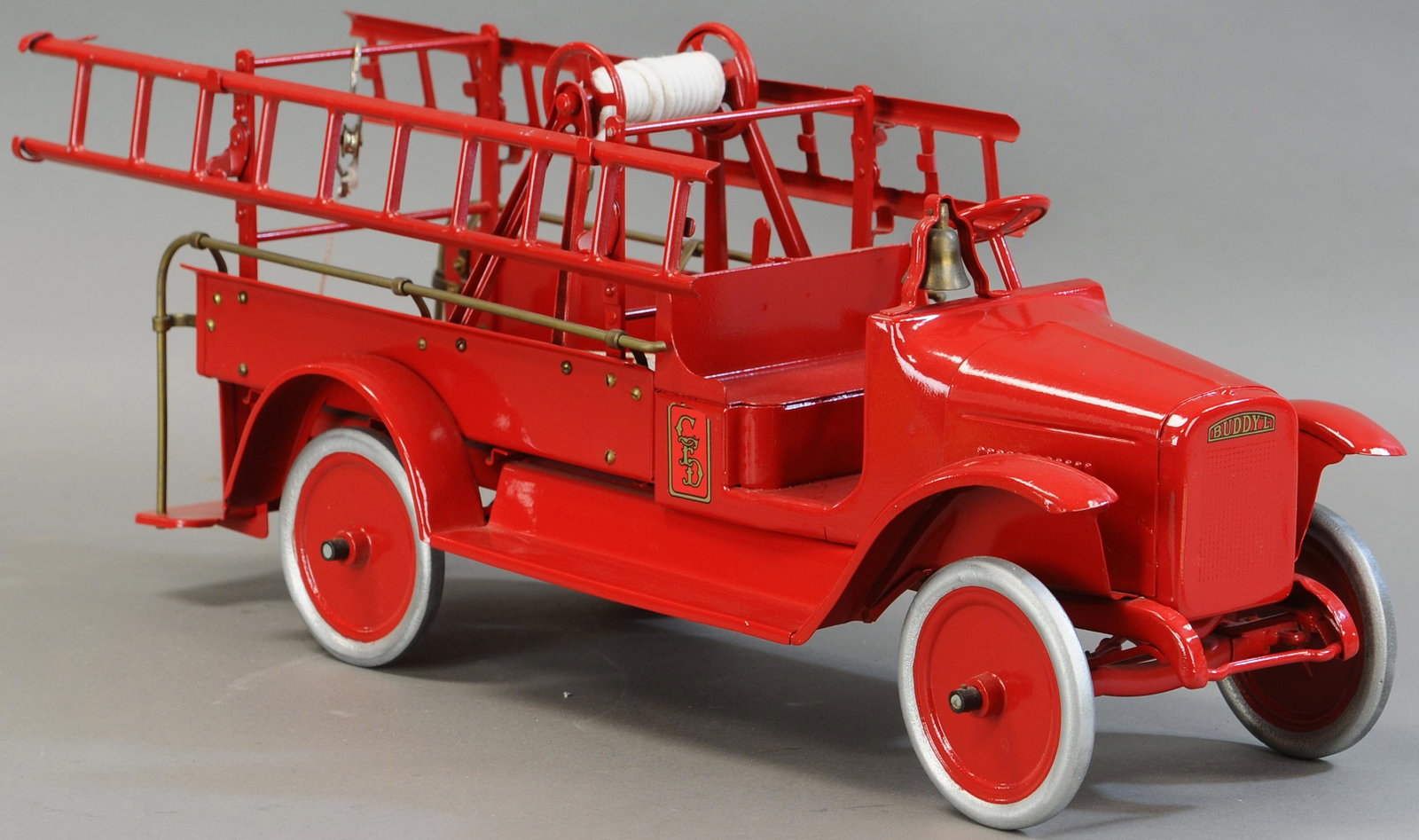 BUDDY L HOOK & LADDER TRUCK: 299. BUDDY L HOOK & LADDER TRUCK | 24" l. | Missing boom crane, Professionally Restored. | $300 - $600