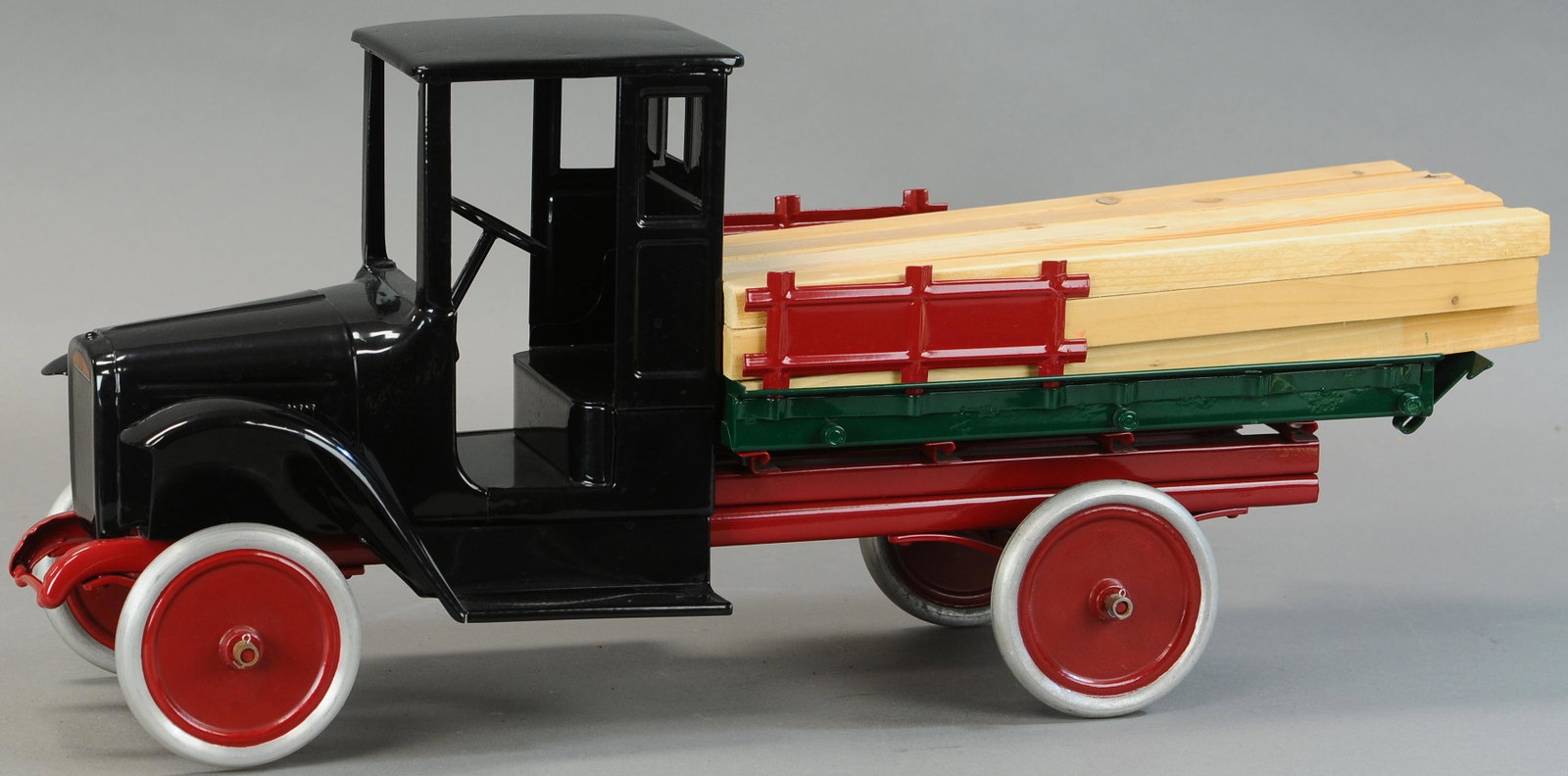BUDDY L LUMBER HAULING TRUCK: 305. BUDDY L LUMBER HAULING TRUCK | 26" l. | Contemporary Example. | $400 - $800