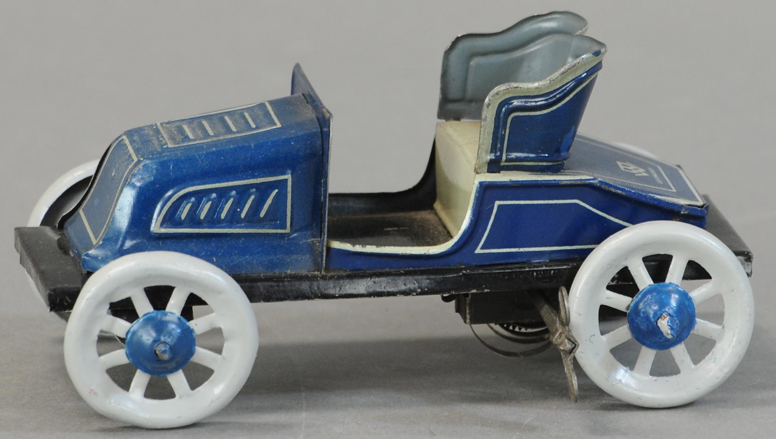 BING DE DION SPYDER RUNABOUT: 102. BING DE DION SPYDER RUNABOUT | Germany, wind-up. | 5.5" l. | Minor touch up to body, wheels are repainted,in otherwise All Original Condition. | $150 - $300