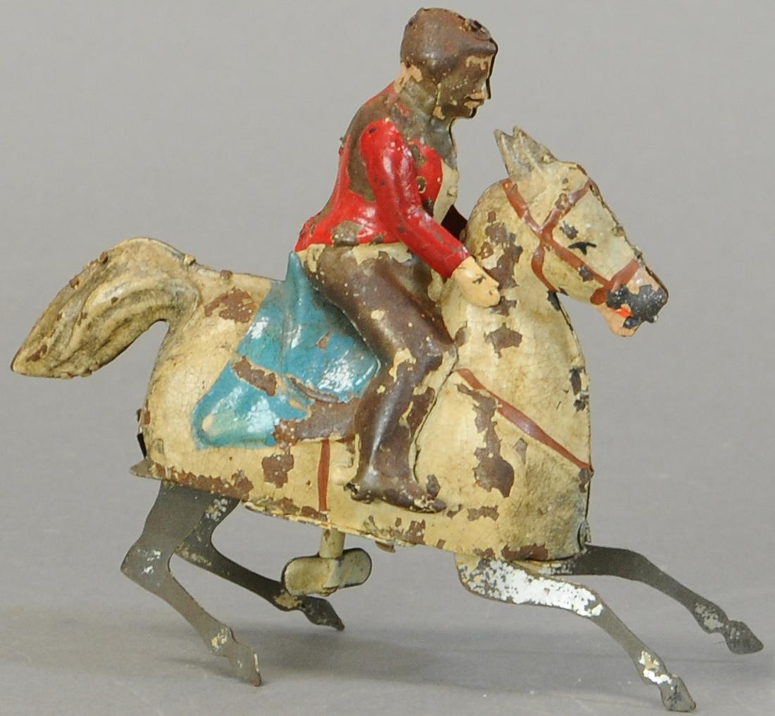 GUNTHERMANN MAN ON PRANCING HORSE: 184. GUNTHERMANN MAN ON PRANCING HORSE | 5" h. | Arms are replaced, otherwisein All Original Condition. | $250 - $500
