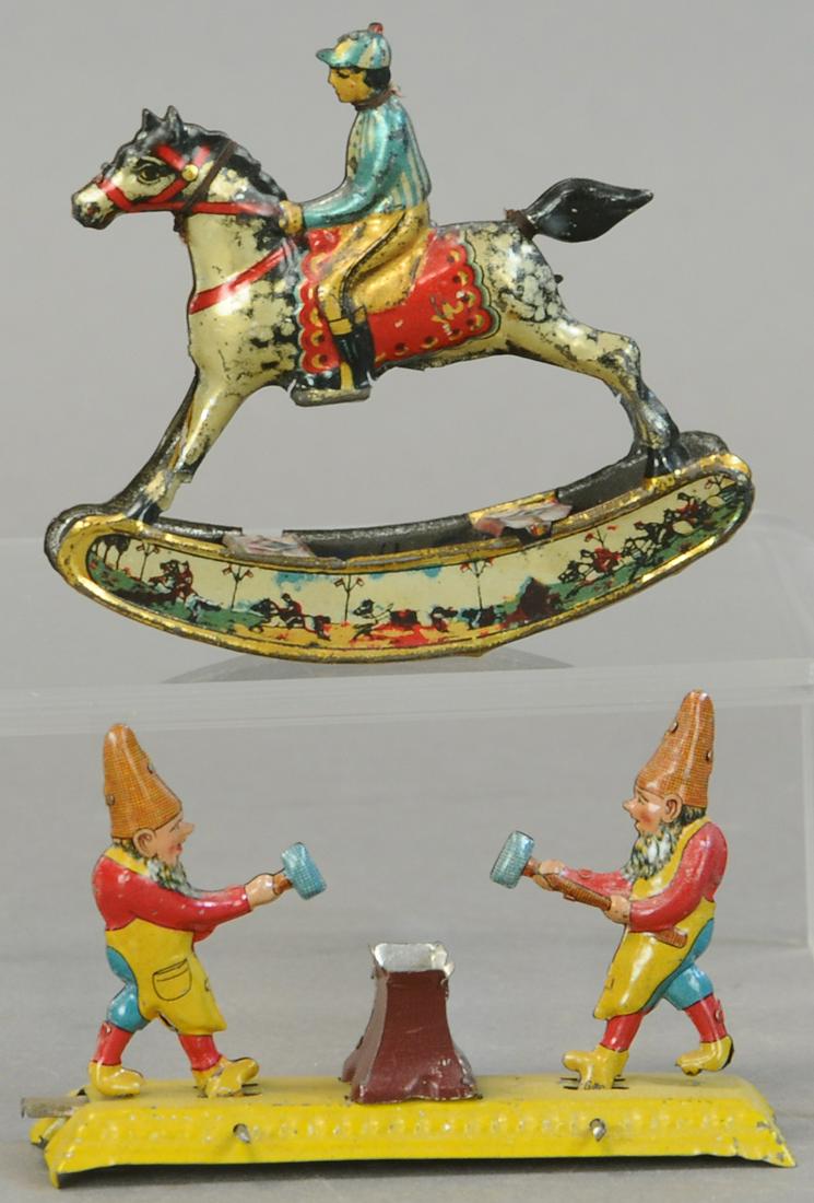 ANVIL GNOMES & ROCKING JOCKEY PENNY TOYS: 204. ANVIL GNOMES & ROCKING JOCKEY PENNY TOYS | 4" l. | Gnome missing top of anvil, horse's tail is repaired. | $150 - $300