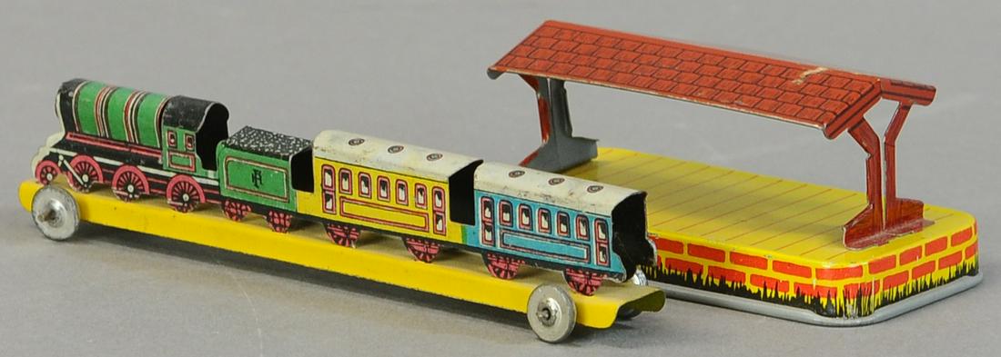 TRAIN W/ STATION PENNY TOY: 208. TRAIN W/ STATION PENNY TOY | 3.75" - 5.5" l. | All Original Condition. | $200 - $400