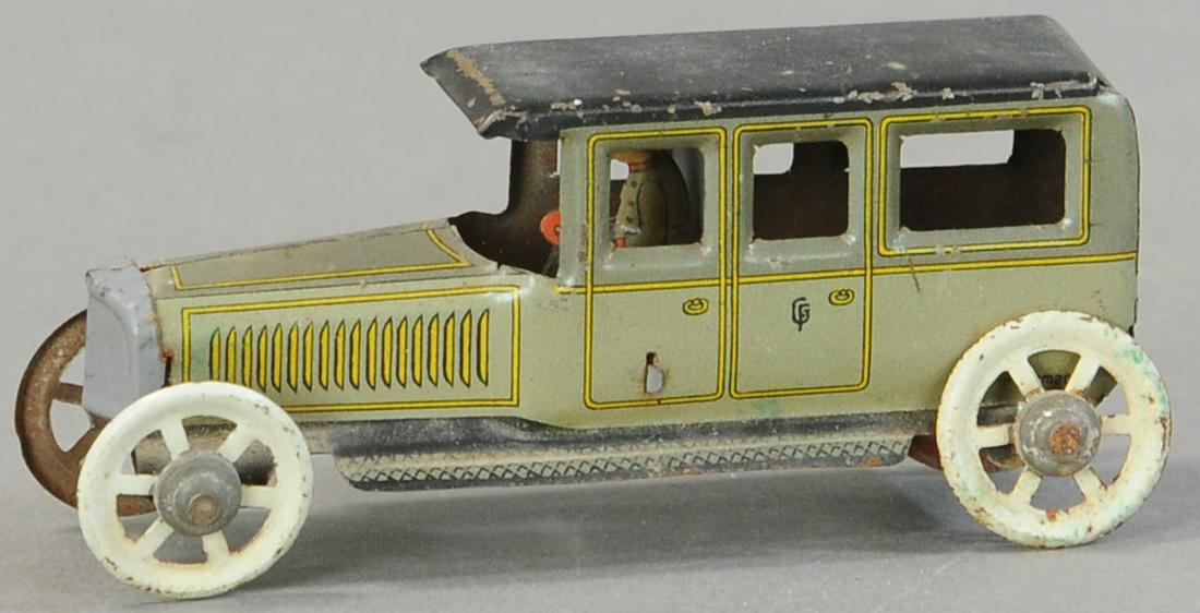 FISCHER SEDAN WITH DRIVER PENNY TOY (1 of 3)