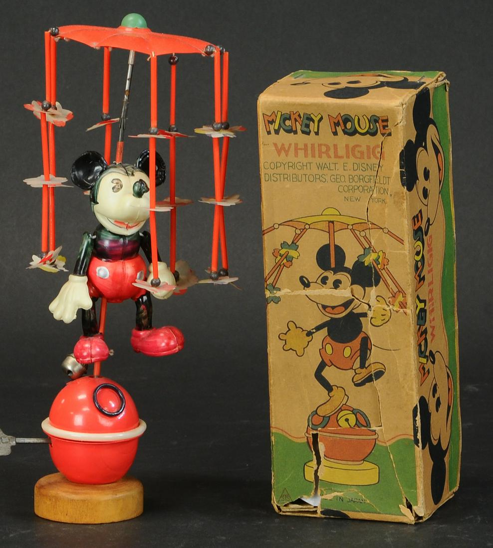 257. BOXED CELLULOID MICKEY MOUSE WHIRLIGIG | Japan,: 257. BOXED CELLULOID MICKEY MOUSE WHIRLIGIG | Japan, 1930s. Rare example with original lithographed box, original decal still intact on Mickey's back, celluloid figure stands atop a ball concealing th