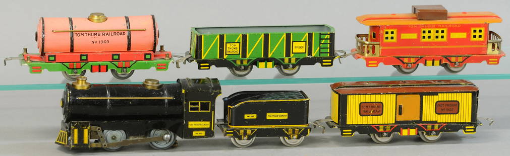 HOGE TOM THUMB FREIGHT SET: 13. HOGE TOM THUMB FREIGHT SET | 0 Gauge. | Provenance: Paul Cole Collection. | Loco 6.5" l. | (Exc. Cond.) | $200 - $400