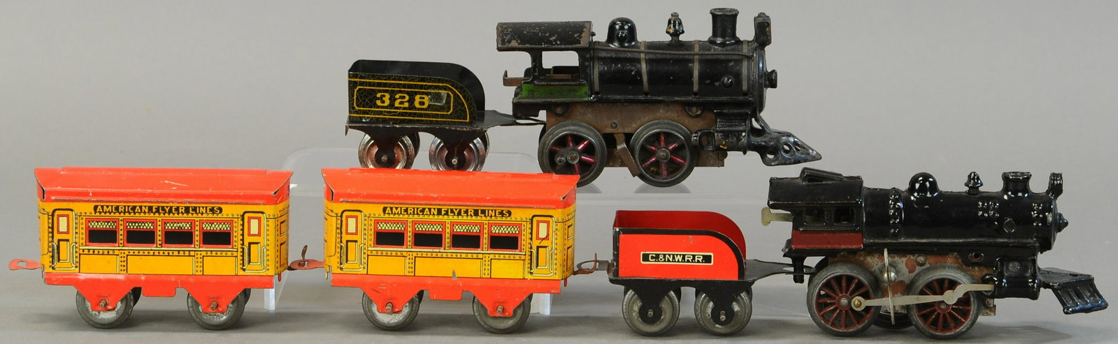 METZEL LOCO AND FLYER SET WITH C&NWRR TENDER: 21. METZEL LOCO AND FLYER SET WITH C&NWRR TENDER | 0 Gauge. | Provenance: Paul Cole Collection. | Loco 6.5" l. | #328 tender missing coupler, Mutzel loco missing tender coupler pin and side rods, over