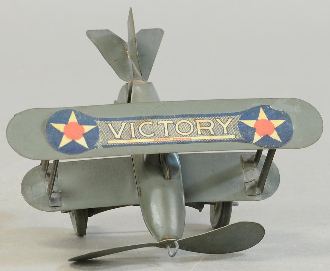 EAGLE MFG VICTORY AIRPLANE: 223. EAGLE MFG VICTORY AIRPLANE | Original decal on wing. | Provenance: Paul Cole Collection. | 5.5" wingspan. | (Exc. Cond.) | $150 - $300