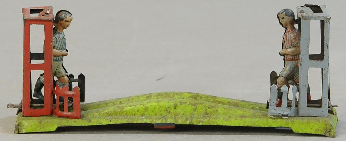 KICKING SOCCER PLAYERS PENNY TOY (1 of 3)