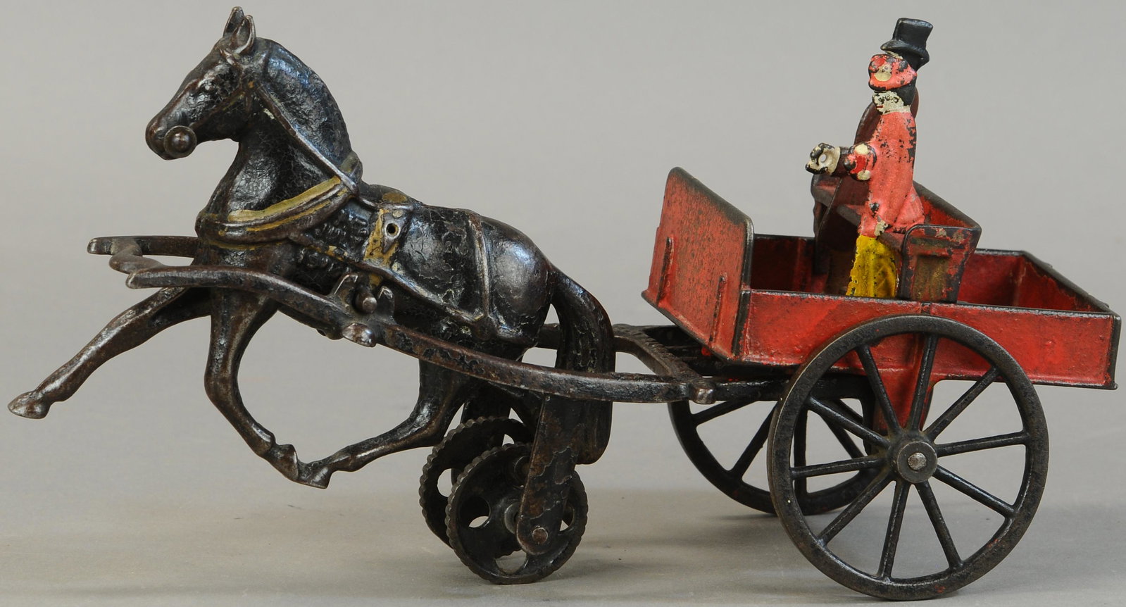 CARPENTER PLANTATION CART: 466. CARPENTER PLANTATION CART | Provenance: Paul Cole Collection. | 13" l. | Figures replaced, (VG Cond.) | $200 - $400