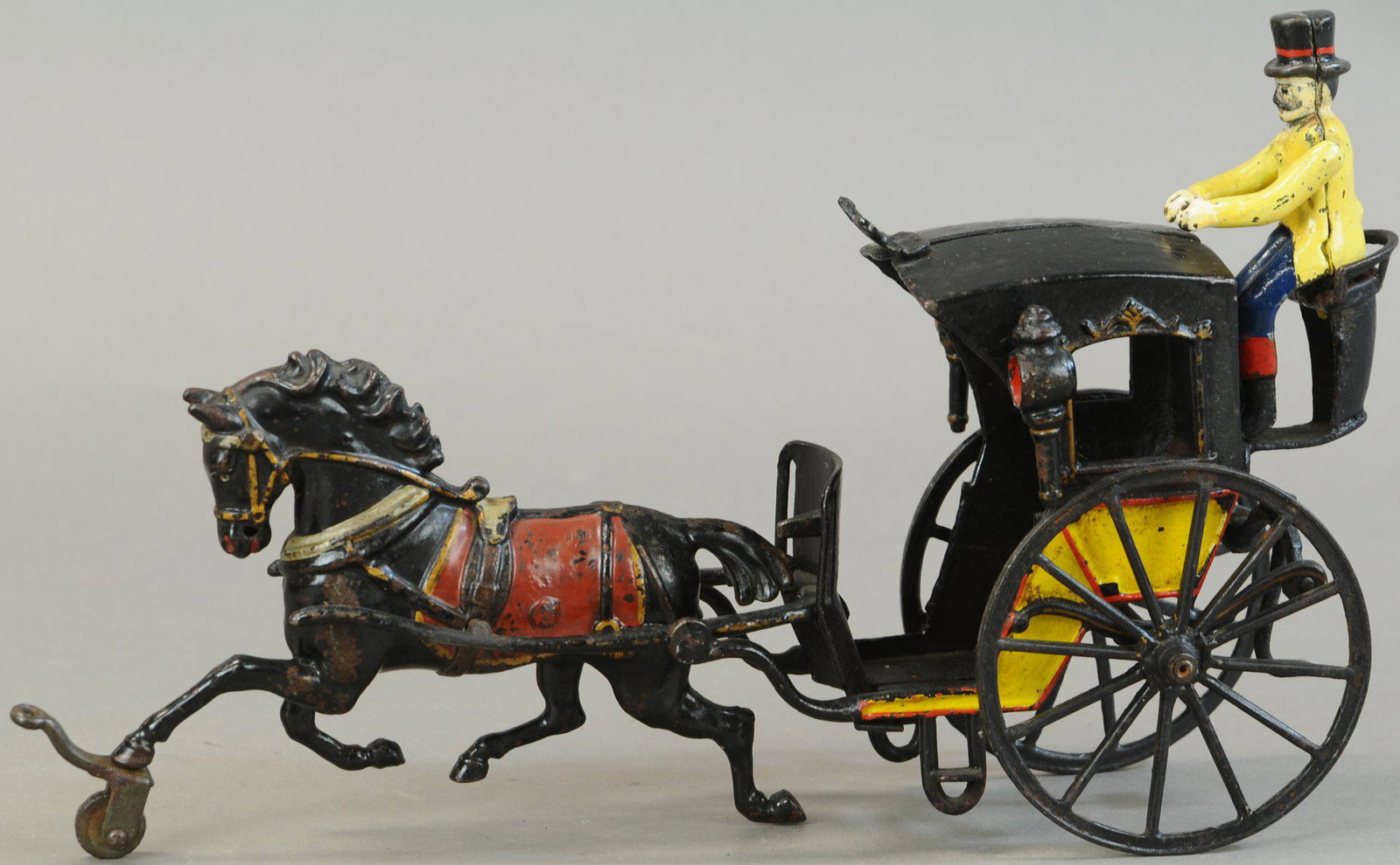 PRATT & LETCHWORTH HANSOM CAB: 470. PRATT & LETCHWORTH HANSOM CAB | Provenance: Paul Cole Collection. | 12" l. | Replaced figure, repair to backseat & step, otherwise (Exc. Cond.) | $300 - $600