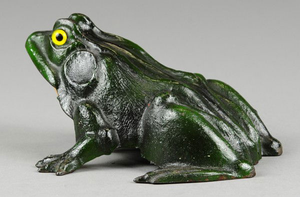 FROG FIGURAL BELL RINGER: R.E. Rich, East Hampton Conn. Debossed inside body, cast iron, painted in green with yellow belly, mouth opens and strikes bell housed inside, feature glass eyes, quite unique item. 6 1/2" l.