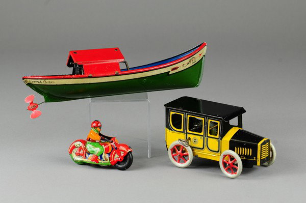 GROUPING OF TRANSPORTATION TOYS: Includes boat, motorcycle and auto, all done in lithographed tin, each with wind up mechanism. 3 1/2" to 10" l.