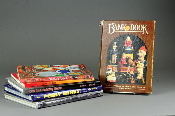 REFERENCE BOOK LOT: Bank books include ceramic, glass and cast iron reference books, features Bob Pierce Cast Iron Building Banks, Duer Penny Banks from Around the World and more.