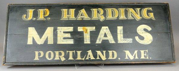 J.P. HARDING METALS, "PORTLAND, ME." SIGN: c. 1900, wood sign with frame, black background, large white lettering, shadowed letters on name, city done in stylized font. 18 1/2" x 45".