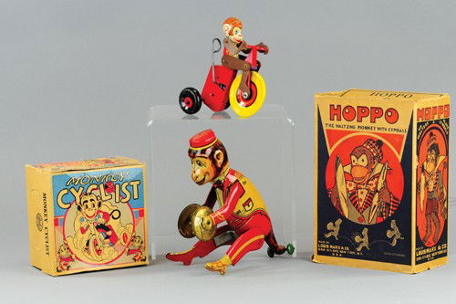 LOT OF TWO MARX MONKEY TOYS: Both boxed, includes "Hoppo" the waltzing monkey with cymbals and monkey cyclist, both key wind operated. 5 3/4" to 8 3/4" h.