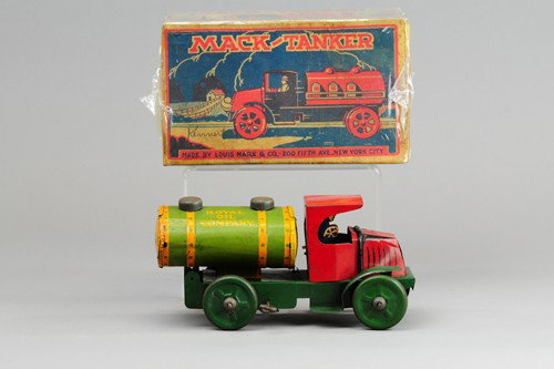 MARX "ROYAL OIL COMPANY" TRUCK: Lithographed tin, done in red cab, yellow and green tank body, key wind operated, seated driver. 8 3/4" l.