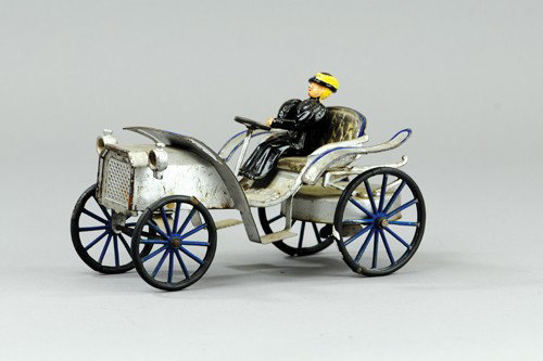 WILKENS PHAETON: C. 1903, pressed steel, painted in silver overall, embossed seating and floor pad, lanterns on hood, rubber tires, spoke wheels, clockwork mechanism. 9" l.