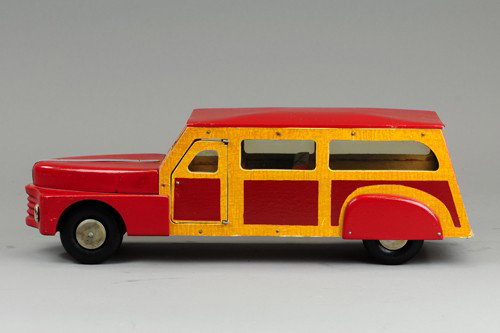 BUDDY 'L' WOODIE STATION WAGON: C. 1940's, unplayed with showing minor rubs to wood body, side decals appear newer on this toy, opening doors, celluloid windows. 18" l.