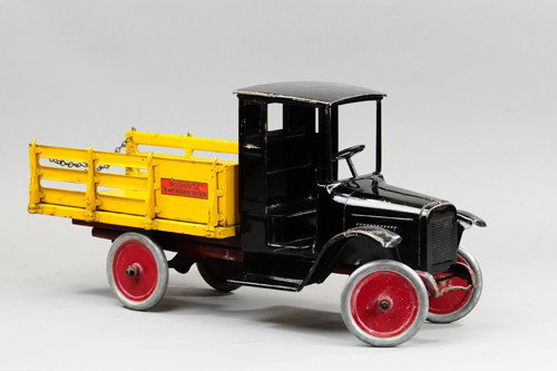 BUDDY 'L' BAGGAGE LINE TRUCK: C. 1926, enclosed cab, open body, chained tailgate, aluminum disc wheels, original truck with paint touch up to areas of cab. 26" l.