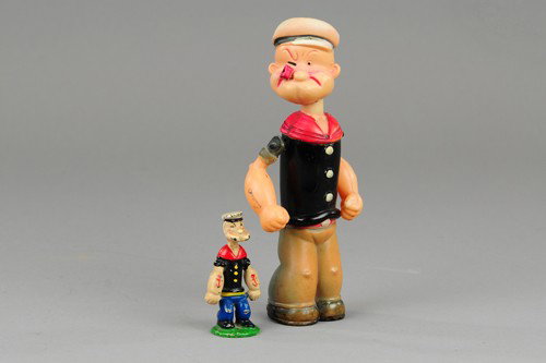 POPEYE CELLULOID WALKER & PAPERWEIGHT: Full figure of Popeye with internal key wind allowing walking motions, together with Hubley paperweight figural © 1929, contemporary Popeye in speedboat included in lot. 3 1/4" & 8 1/4" h.