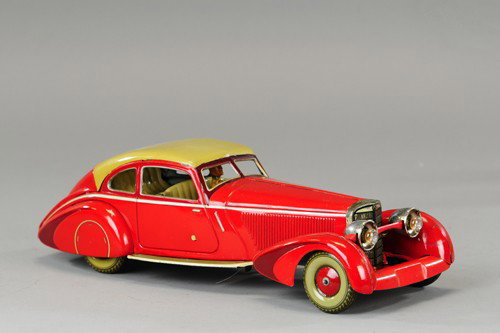 *TIPPCO MERCEDES 540K COUPE: Germany, c. 1935, a luxury tin example, striking red litho, sleek auto-bahn coupe design, rear window die cut into roof top, electric headlights, embossed seating with driver, glamorous wheel cover ap