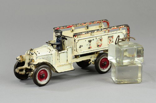 KENTON OPEN CAB ICE TRUCK WITH DRIVER: Cast iron, desirable white painted open seat cab with railed Ice bed body, embossed sides, rear platform, painted disc wheels. 10" l.