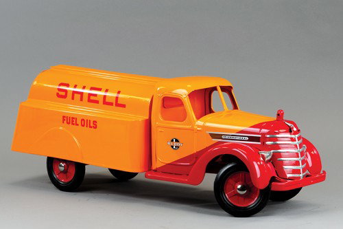 BUDDY 'L' 1928 INTERNATIONAL SHELL TRUCK: Pull model missing its handles, complete restoration to all original truck, this example is very hard to find, bright color scheme of orange and red duo tone cab, full decals and lettered tank body, r