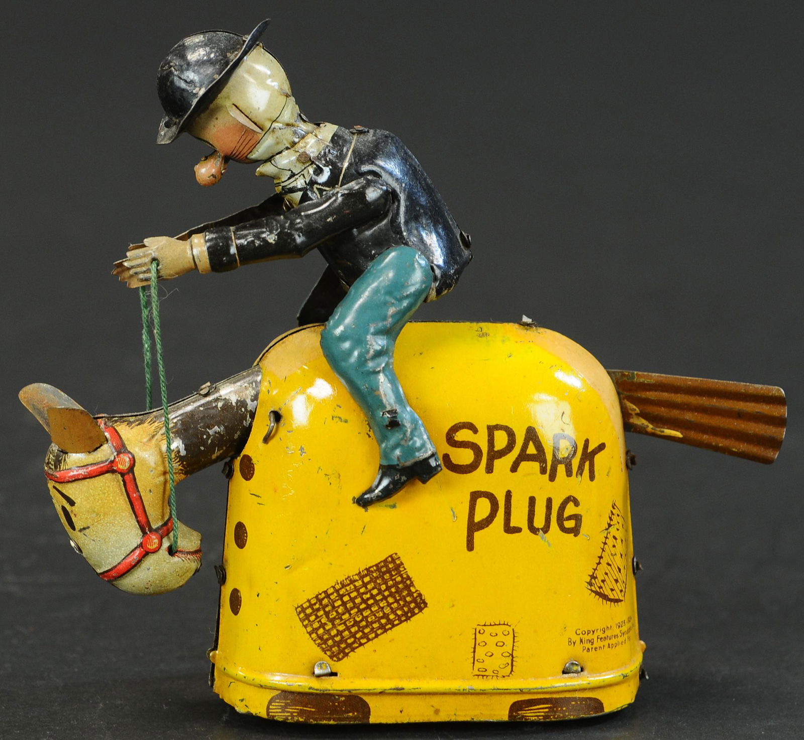 NIFTY BARNEY GOOGLE RIDING SPARK PLUG: 205. NIFTY BARNEY GOOGLE RIDING SPARK PLUG | Made by Chein for Nifty. | 7 " h. | Common factory touch-ups and the backside of each figure, all original in (Exc. Cond.) | $800 - $1,200