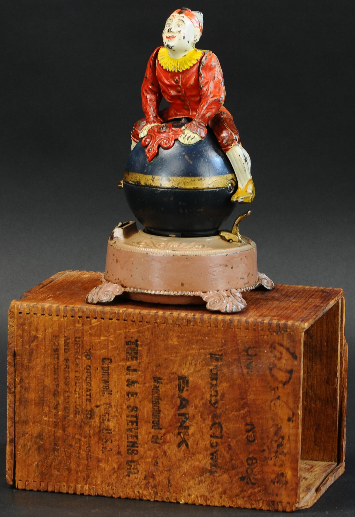 BOXED CLOWN ON GLOBE MECHANICAL BANK (1 of 5)