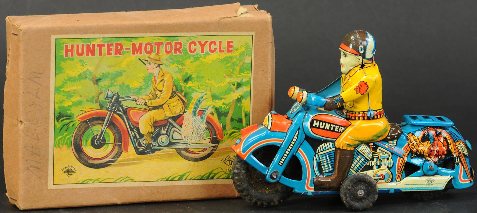 BOXED PRE-WAR JAPAN HUNTER MOTORCYCLE: 1063. BOXED PRE-WAR JAPAN HUNTER MOTORCYCLE | 6.5" l. | One tear at edge of lid, missing tin gun, otherwise (Exc. - Pristine Cond.) | $600 - $900