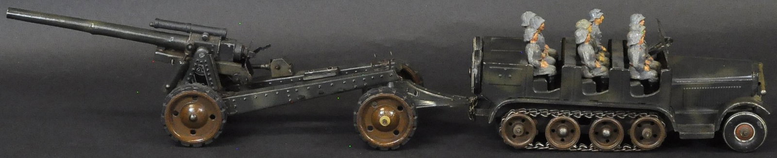 TIPPCO HALF-TRACK W/ FIELD GUN: 1298. TIPPCO HALF-TRACK W/ FIELD GUN | Late production set with full soldier crew, clockwork motor working, complete with gun tow trailer. | Truck 8.5" l. | (Exc. - Pristine Cond.) | $600 - $900