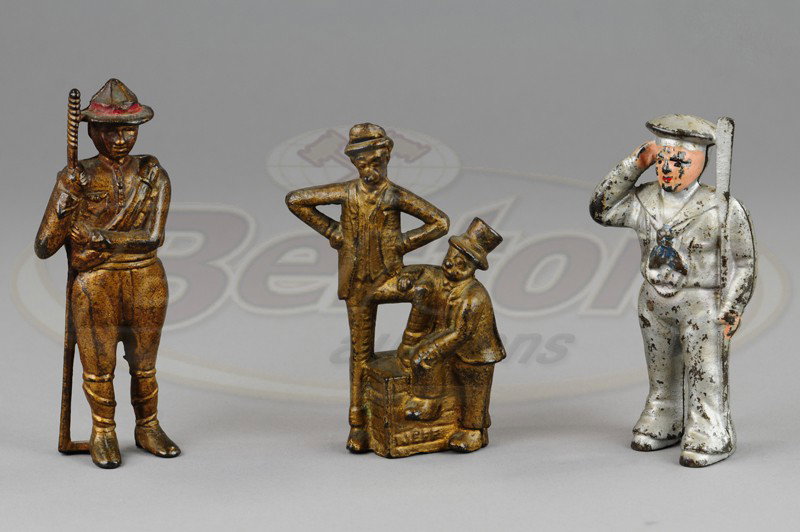 GROUPING OF FIGURAL STILL BANKS: Cast iron, includes silver painted Sailor, gold painted Boy Scout and Mutt & Jeff at soap box still bank. 5 1/4" to 6" h.