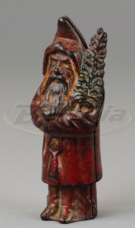 SANTA CLAUS STILL BANK: Wing, cast iron, wearing red hooded robe, gold boots, white beard and face, holds green tree in hand. 5" h.