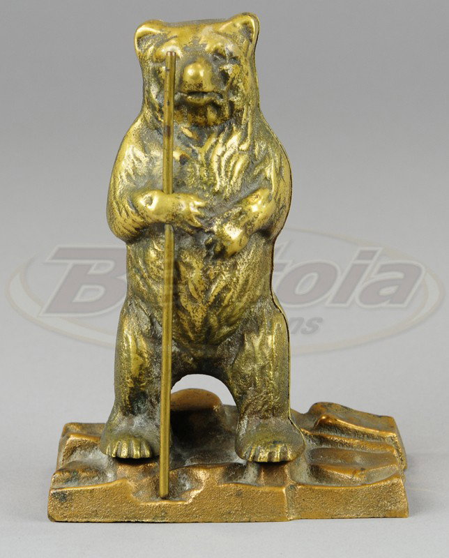 STANDING BEAR STILL BANK: Made of brass, molded in style of bear on hind legs with ornate base, incised "Joyce" on front. 6 1/4" h.