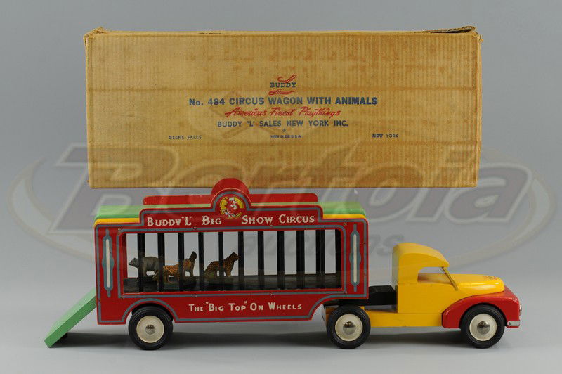 BUDDY 'L' BOXED WOODEN CIRCUS WAGON TRUCK: C. 1948, very colorful red and yellow cab, pulls red, yellow and green circus cage van, reads "Buddy 'L' Big Show Circus," on sides, includes small animals. 25 1/2" l.