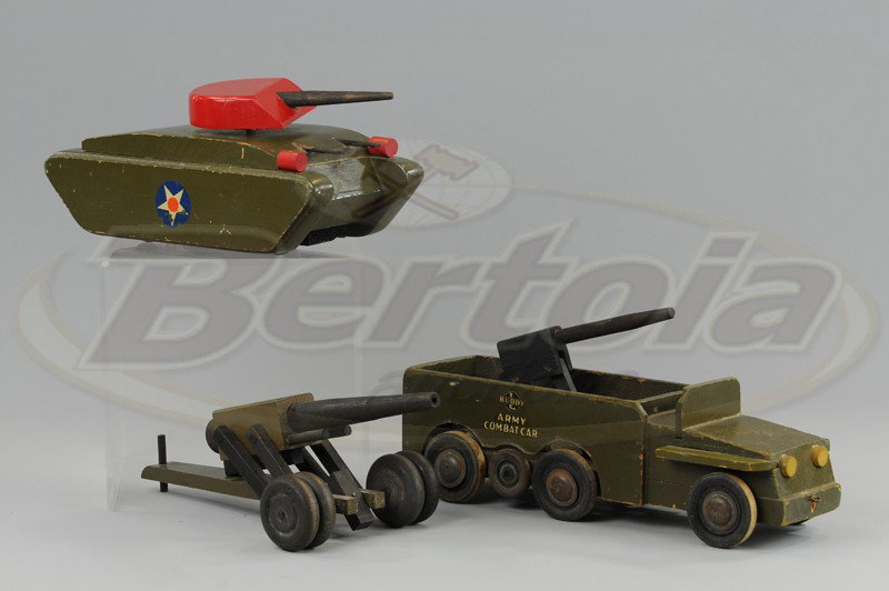BUDDY 'L' WOOD MILITARY GROUPING: C. 1943, olive drab green tank and Army combat car, together with field cannon, tag marked "Commando Toys," car has anti-aircraft cannon in bed of body. Tank - 13" l. Car - 24" l.