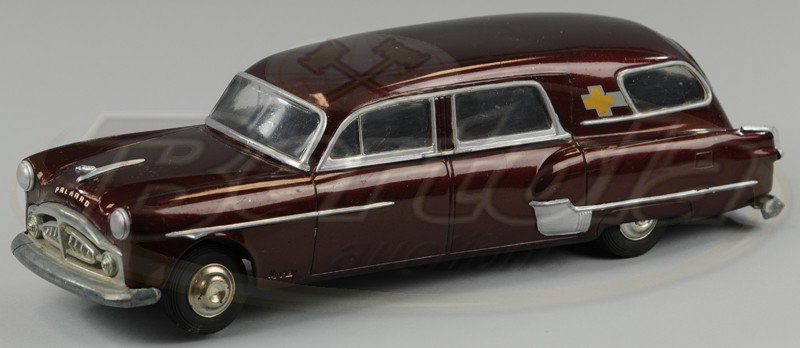 PACKARD "HENNY" AMBULANCE: AMC, plastic model, done in rich maroon body, cross emblem at rear, window inserts complete, clockwork driven. 12" l.