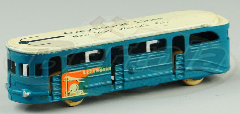 NEW YORK WORLD'S FAIR BUS: Arcade, cast iron, painted in blue body with white roof, decals appear on sides, roof stenciled, "Greyhound Lines N.Y. World's Fair." 6 3/4" l.