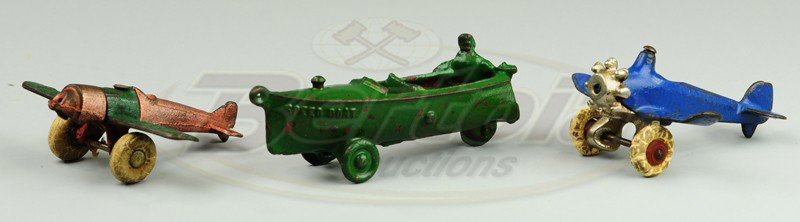 LOT OF SMALL CAST IRON TOYS: Includes Ice Truck, Oil Truck, "SPEED BOAT" with cast driver and two small airplanes.
