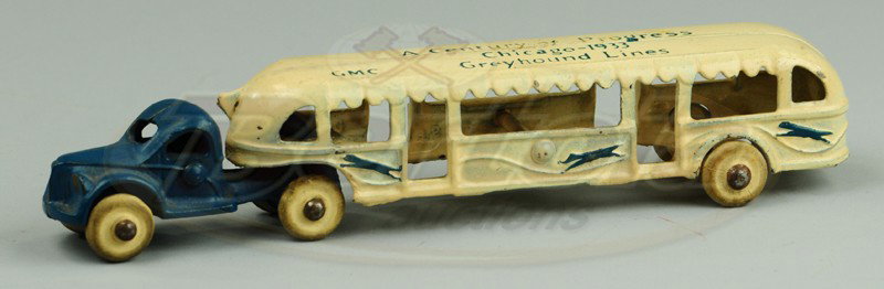 ARCADE CENTURY OF PROGRESS BUS: 1933, cast iron, painted in blue GMC cab, white passenger trailer, stenciled roof, rubber tires. 7 3/8" l.