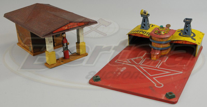 GARAGE AND AIRPORT DISPLAY TOY: Includes Gibbs garage with fuel pump and covered drive-thru, together with Marx City Airport done in lithographed tin with two hangers. 15" to 17".